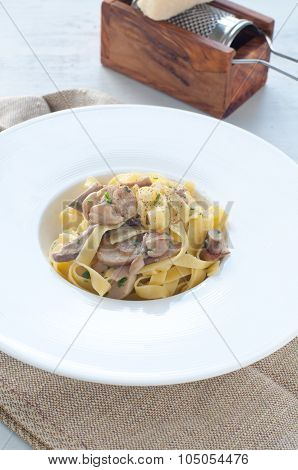 pasta And Rice With Porcini Mushrooms Served With Butter And Parmesan