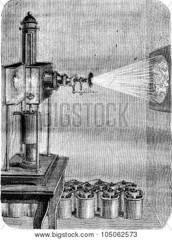 Magic Lantern became the photoelectric microscope, vintage engraved illustration. Magasin Pittoresque 1877.