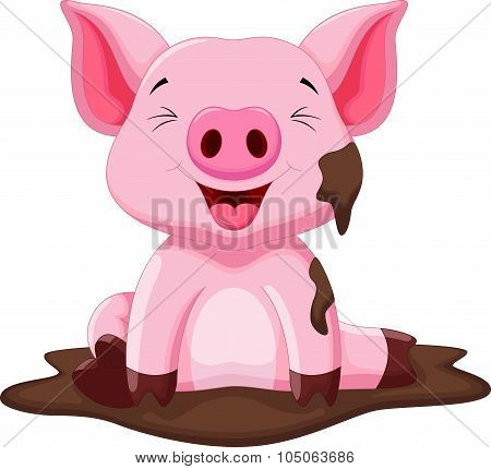 Funny pig playing in the mud