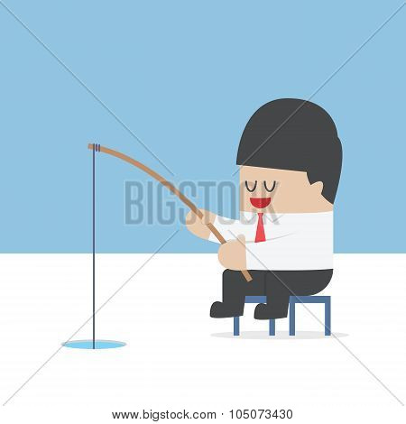 Businessman Fishing From A Hole On Ice