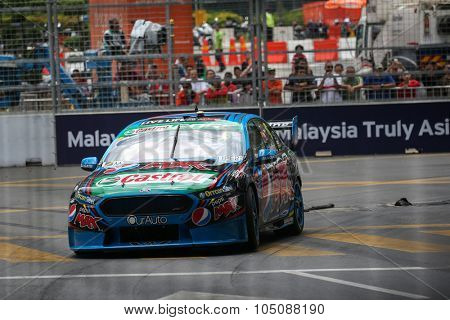 KUALA LUMPUR, MALAYSIA - AUGUST 08, 2015: Chaz Mostert from the Pepsi Max Crew team races in the V8 Supercars Street Challenge at the 2015 Kuala Lumpur City Grand Prix.