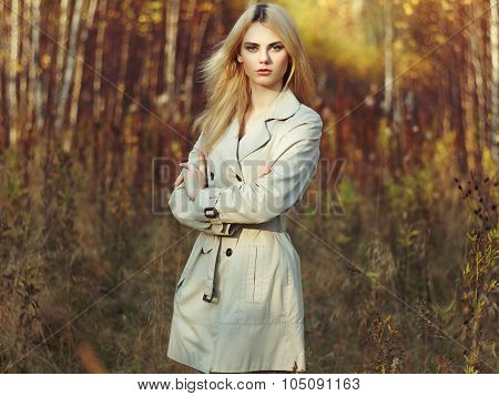 Portrait Of Young Beautiful Woman In Autumn Cloak