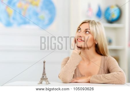 Pleasant girl planning her trip