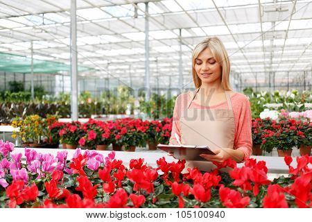 Nice florist working with flowers