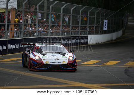 KUALA LUMPUR, MALAYSIA - AUGUST 08, 2015: Fairuz Fauzy drives a Lamborghini Gallardo FL2 GT3 car  takes turn 2 of the city streets in the KL City GT CUP Race of the 2015 Kuala Lumpur City Grand Prix.