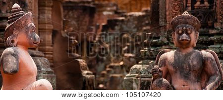 Stone sculputure sitting in front of temple B