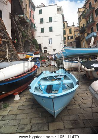 Riomaggiore Cinque Terre Italy With Old Fishing Boats On Street With Historic Buildings Italian Rivi