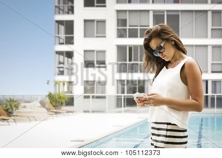 Beautiful Brunette Using Her Cellphone