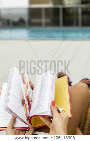 Detail Of A Woman Reading A Book