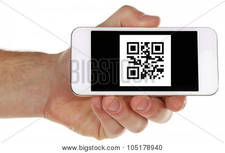 Hand holding smart phone with QR code on screen