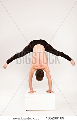 Man Stretch Gymnastic Balance Posture Isolated Studio On White Background.