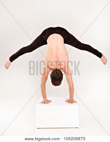 Man Stretch Gymnastic Balance Posture Isolated Studio On White Background.