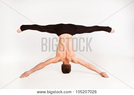 Man Stretch Gymnastic Balance Posture Isolated Studio On White Background.