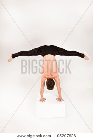 Man Stretch Gymnastic Balance Posture Isolated Studio On White Background.