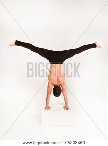 Man Stretch Gymnastic Balance Posture Isolated Studio On White Background.