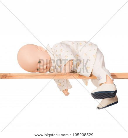 Baby doll on a crossbar