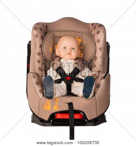 Baby doll in a booster seat for a car