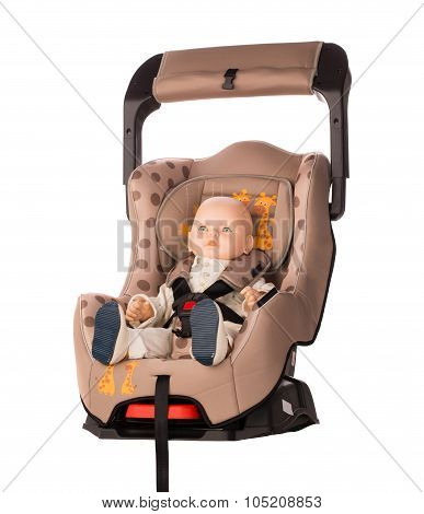 Baby doll in a booster seat for a car