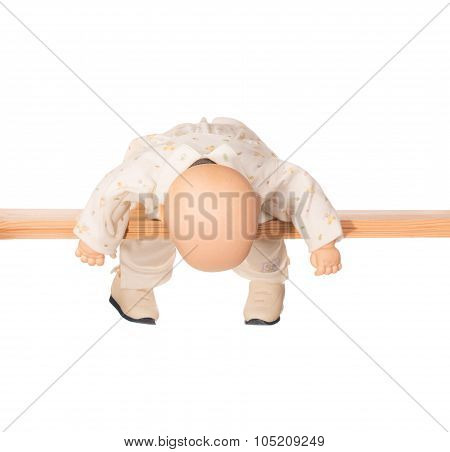 Baby doll on a crossbar
