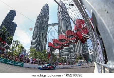 KUALA LUMPUR, MALAYSIA - AUGUST 09, 2015: Chaz Mostert from the Pepsi Max Crew team races in the V8 Supercars Street Challenge at the 2015 Kuala Lumpur City Grand Prix.