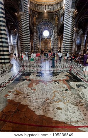 SIENA, ITALY - October 10, 2015: Interior of Siena Cathedral, Italian Duomo di Siena, Santa Maria Assunta. The 13th century church with its mosaic floor is a major tourism attraction in Siena, Italy 