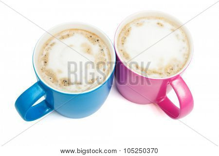 two cups of cappuccino on a white background