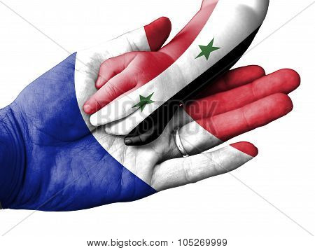 Adult Man Holding A Baby Hand With France And Syria Flags Overlaid. Isolated On White