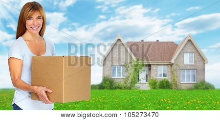 Woman with moving box. New house owner.