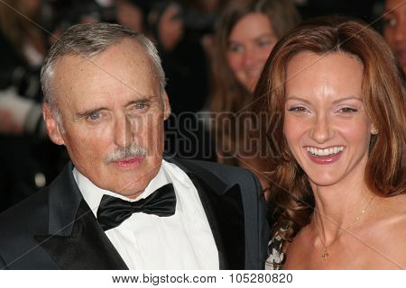 CANNES, FRANCE - MAY 11: Dennis Hopper with his wife attend the 58th Cannes Film Festival  premiere of opening film 'Lemming'at the Grand Theatre Lumiere on May 11, 2005 in Cannes, France