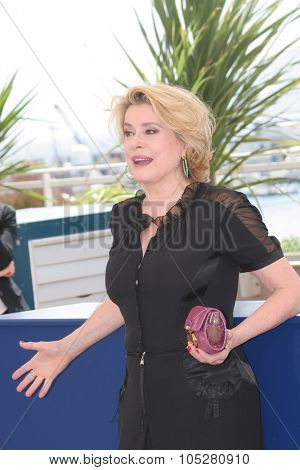 CANNES, FRANCE - MAY 12: Catherine Deneuve poses for a picture during a photocall at the 58th International Cannes Film Festival May 12, 2004 in Cannes, France.