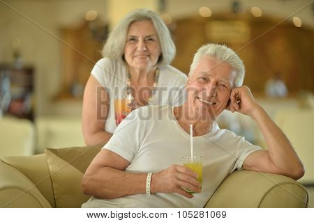old couple drinking juice