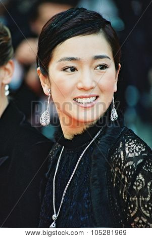 CANNES, FRANCE - MAY 19: Chinese actress Gong Li arrives for the gala screening of  film 'Punch-drunk love' during the 55th Cannes film festival May 19, 2002 in Cannes, France