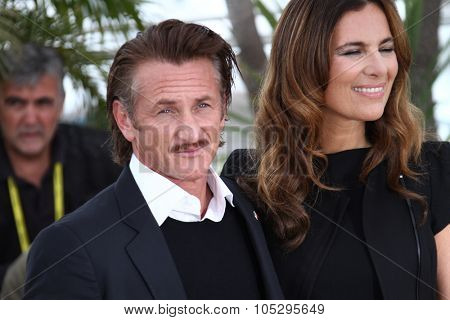 CANNES, FRANCE - MAY 18: Sean Penn, Roberta Armani  pose at the 'Haiti Carnaval In Cannes' photocall during the 65th Annual Cannes Film Festival on May 18, 2012 in Cannes, France.