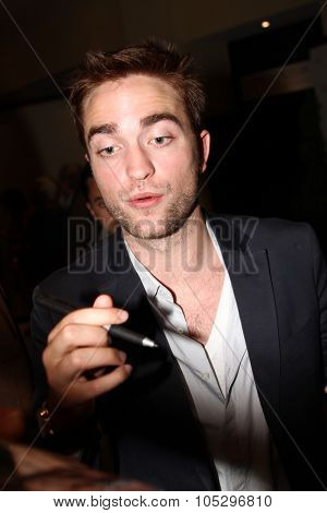 CANNES, FRANCE - MAY 25: Robert Pattinson poses at the 'Cosmopolis' photocall during the 65th Annual Cannes Film Festival at Palais des Festivals on May 25, 2012 in Cannes, France.