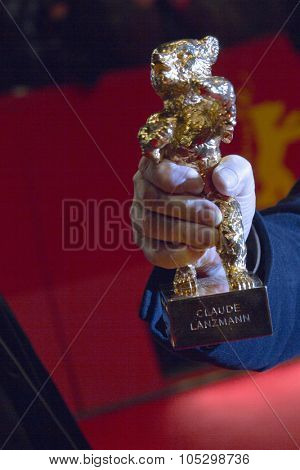BERLIN, GERMANY - FEBRUARY 16: Claude Lanzmann (detal) and Golden Bear attends the Closing Ceremony of the 63rd Berlinale Film Festival at Berlinale Palast on February 14, 2013 in Berlin, Germany.