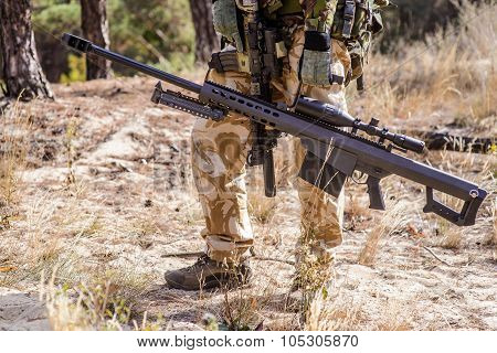 Soldier With Big Sniper Rifle In Forest
