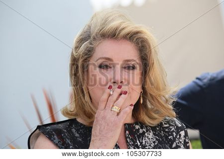 CANNES, FRANCE - MAY 21: Actress Catherine Deneuve attends 'L'Homme Qu'On Aimait Trop' photocall at the 67th Annual Cannes Film Festival on May 21, 2014 in Cannes, France.