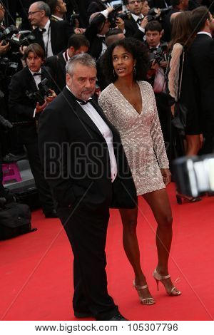 CANNES, FRANCE - MAY 17: Luc Besson; Virginie Besson  attend the 'Saint Laurent' premiere at the 67th Annual Cannes Film Festival on May 17, 2014 in Cannes, France.