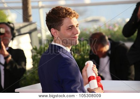 CANNES, FRANCE - MAY 24: Xavier Dolan winner of the Best Director award, attends the Palme D'Or Winners photocall during the 67th Cannes Film Festival on May 24, 2014 in Cannes, France.