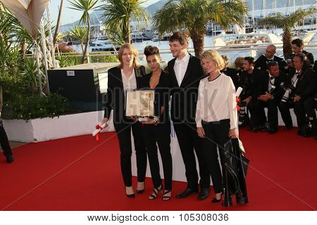 .CANNES, FRANCE - MAY 24:  Claire Burger, Samuel Theis pose with the Camera d'Or attend the Palme D'Or Winners photocall during the 67th  Cannes Film Festival on May 24, 2014 in Cannes, France.