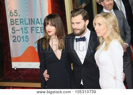 BERLIN, GERMANY - FEBRUARY 11: Jamie Dornan, Dakota Johnson  attend the 'Fifty Shades of Grey' premiere during the 65th Berlinale Film Festival at Zoo Palast on February 11, 2015 in Berlin, Germany.