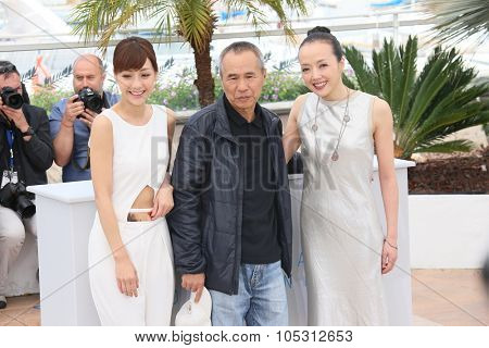 Hseih Hsin-Ying, Hou Hsiao-Hsien and Sheu Fang-Yi attend a photocall for 'Nie Yinniang' during the 68th annual Cannes Film Festival on May 21, 2015 in Cannes, France.
