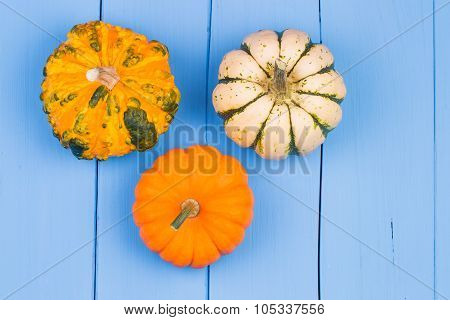 Pumpkins On A Wooden Table