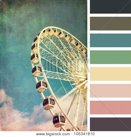 A ferris wheel, vintage style,  in a colour palette with complimentary colour swatches