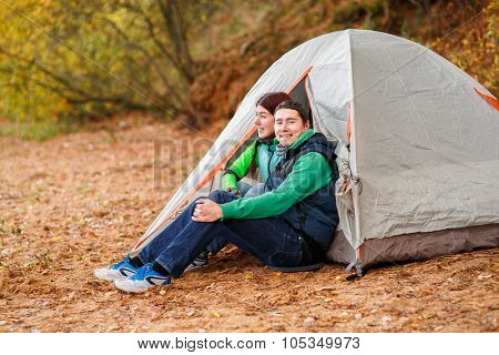 Attractive young couple camping trip in forest