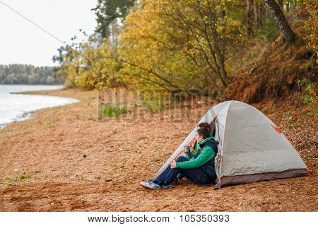 Attractive young couple camping trip in forest