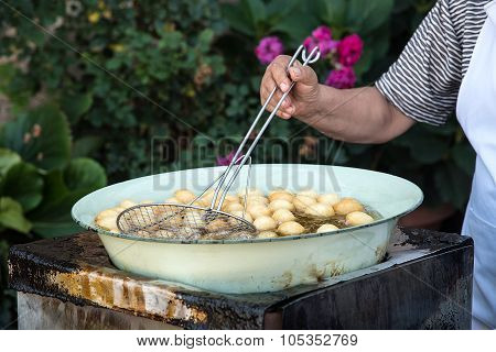 Woman Cooking Delicious  Loukoumades Pastry