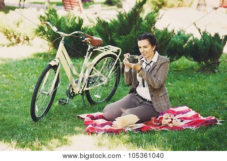 Young Woman With Bicycle At The Picnic In The Park