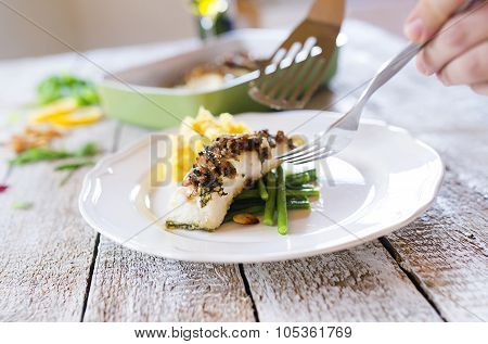 Man serving fish