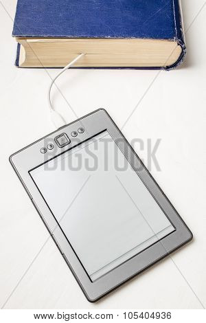 eBook connected to the old thick blue book with a cable